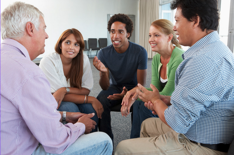 People sat in a group talking.