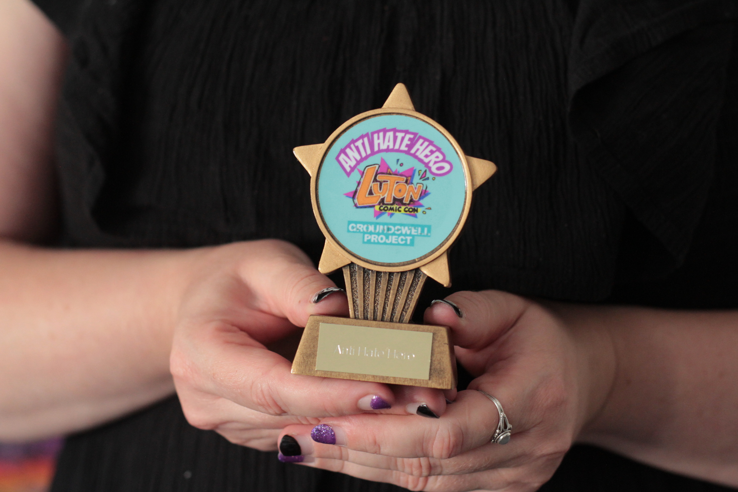 Clare with her AntiHate hero award from Comic con.