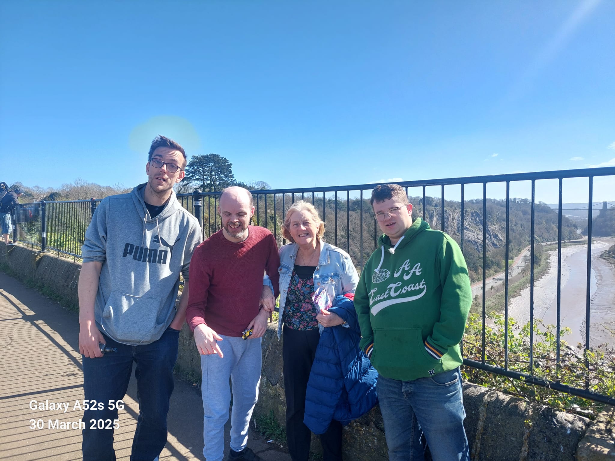 Liz Gray, with her son Stephen, and two men she supports.