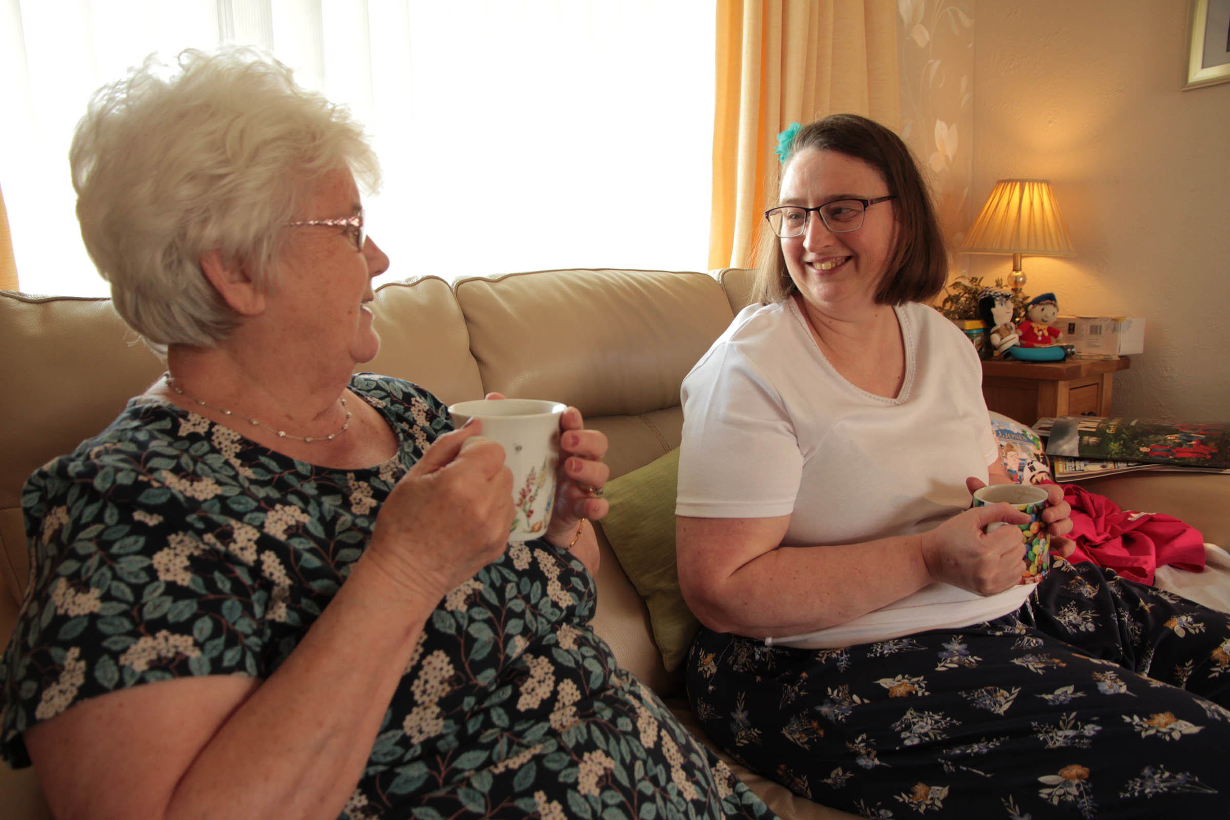 Wendy having a cup of tea with her Shared Lives carer.