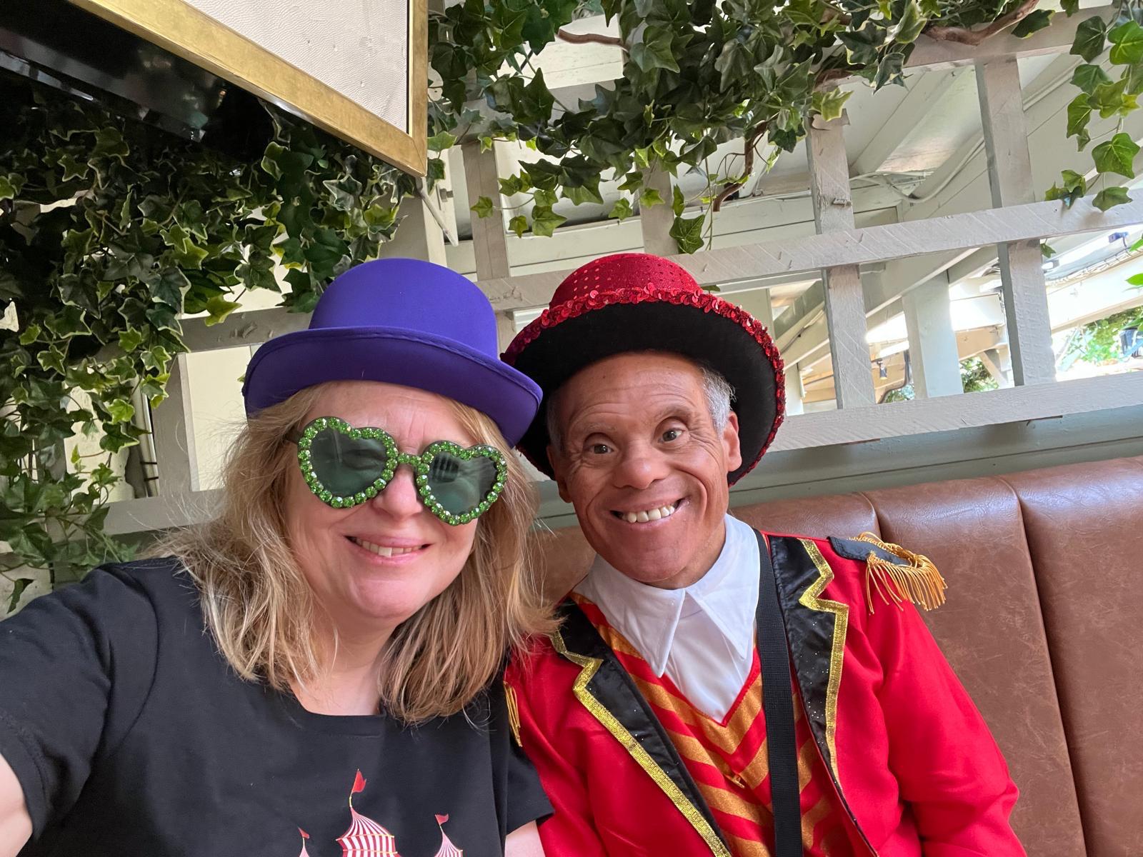 A woman and man sat together in fancy dress