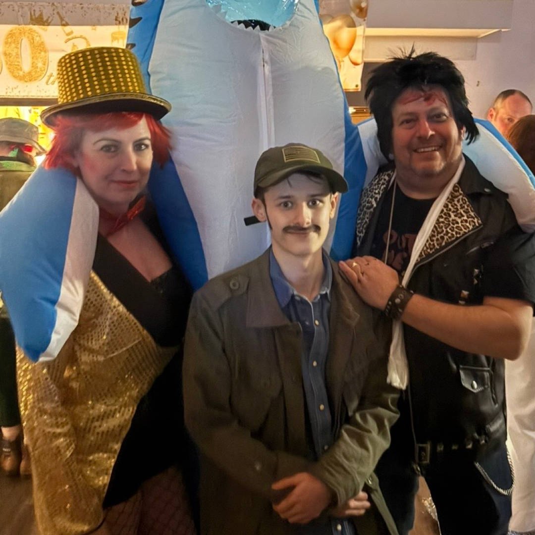 A picture of Dante and his Shared Lives carers at a dressing-up event