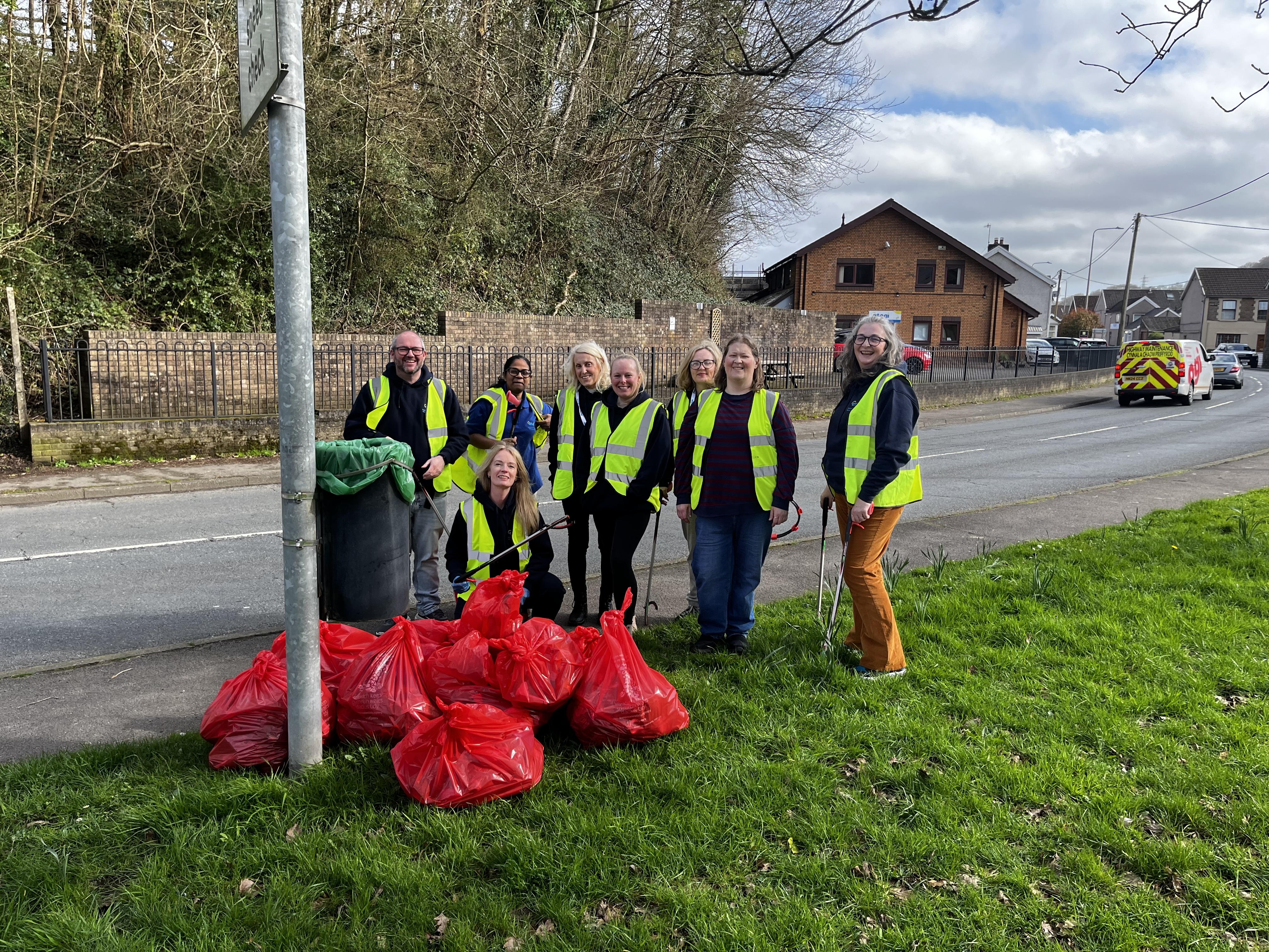 Wales team with their bags of rubbish after the litter pick.