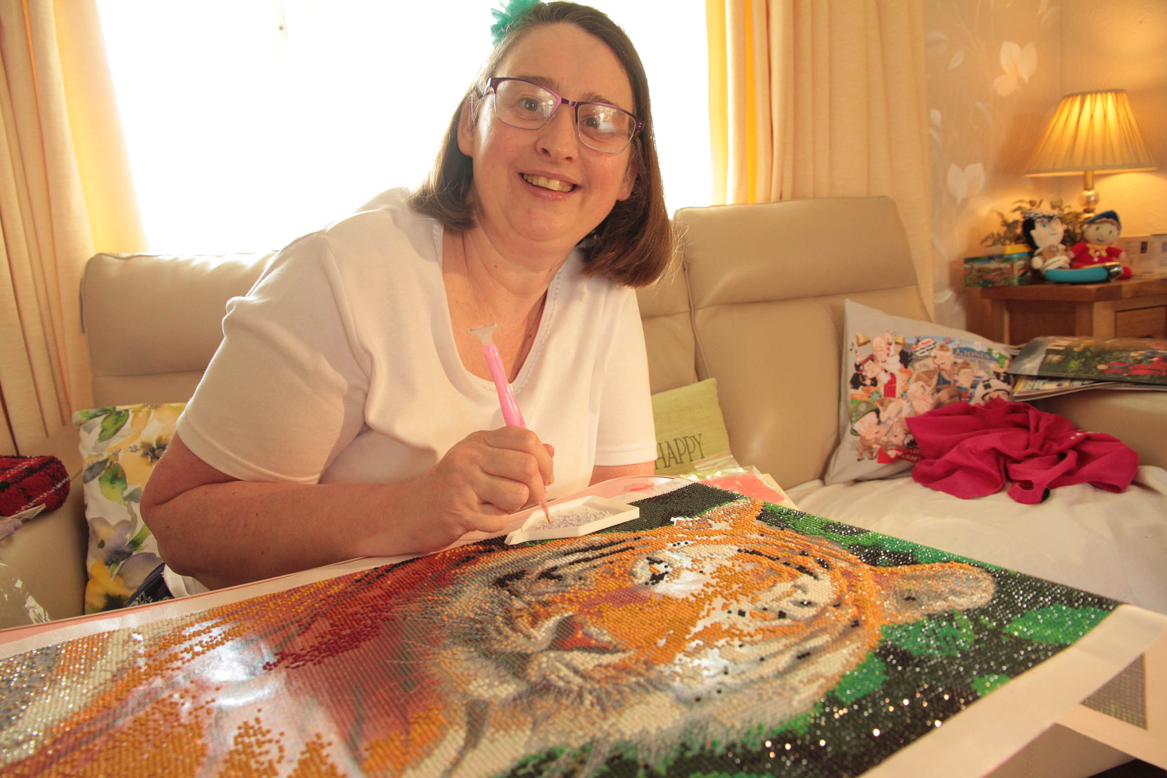 Wendy doing her diamond art, she is creating a Tiger.