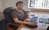 Sam, Ategi intern, sat behind a desk