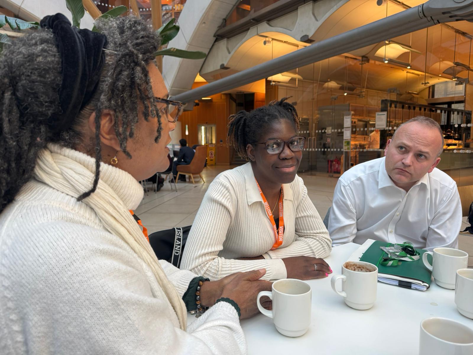 Neil Coyle, MP for Bermondsey and Old Southwark, talking to Shared Lives carer, Lorna and the lady she supports, Miriam at Westminster.