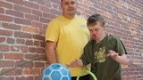 Richie, a young man with learning disabilities who is being supported to do some bowling with his support worker.
