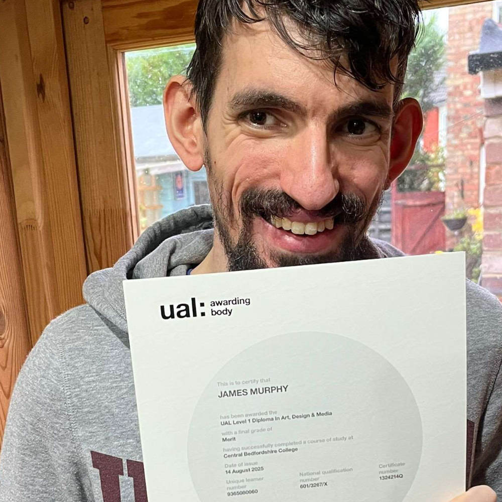 James pictured holding his first certificate