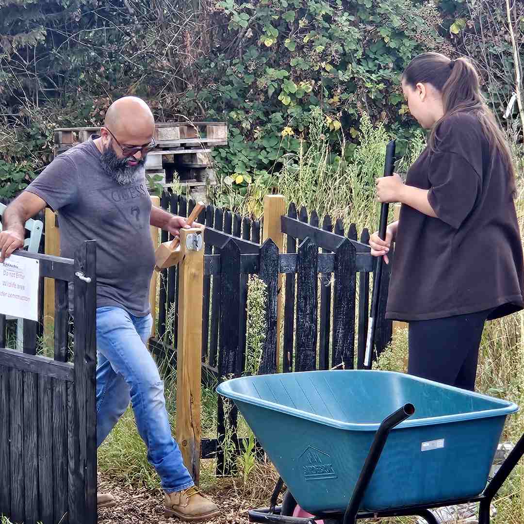 A picture of two volunteers hard at work
